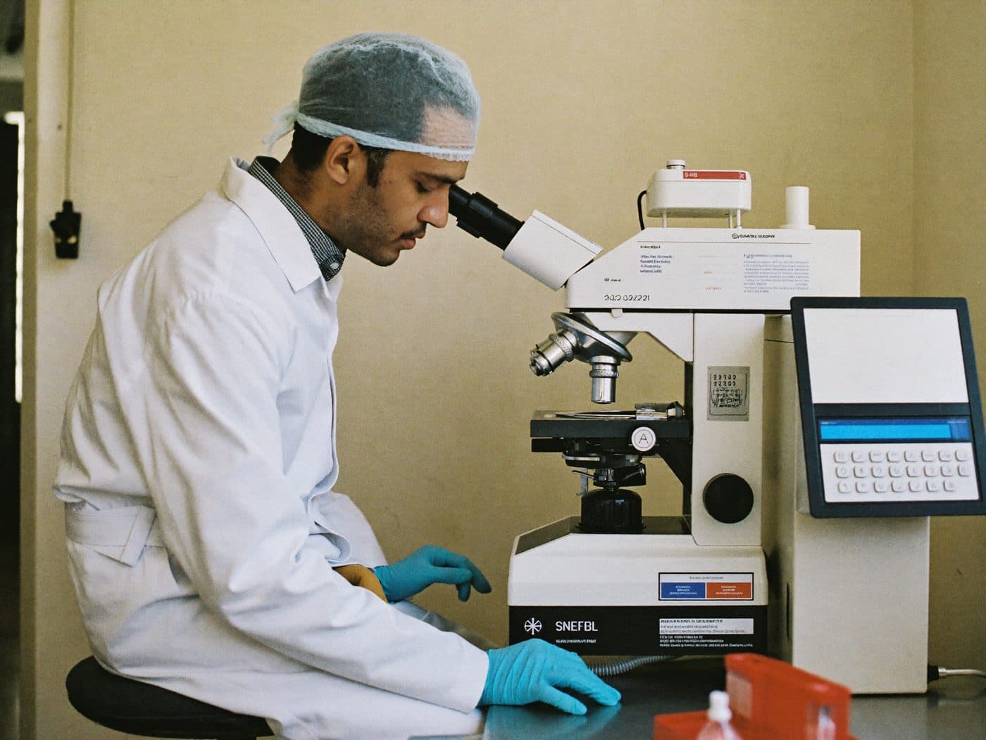 Laboratory technician working at a lab bench in a hospital laboratory
